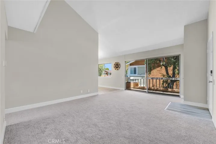 Open floor plan with outdoor view of foliage