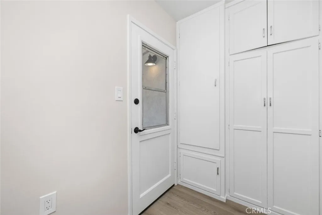 Laundry room has additional storage space and access to backyard.