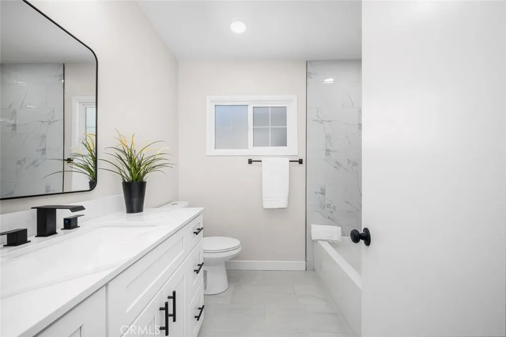 Beautifully remodeled bathroom showcasing a luxurious, spa-like atmosphere.
