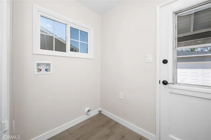 Conveniently located off from kitchen, laundry room with new supply lines.
