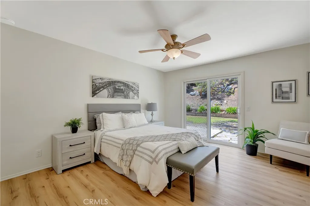 Main bedroom with sliding door to the back yard.
