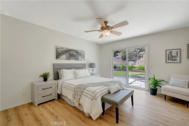 Main bedroom with sliding door to the back yard.