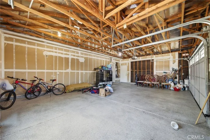 EXTENSIVE 3-CAR GARAGE / STORAGE SPACE