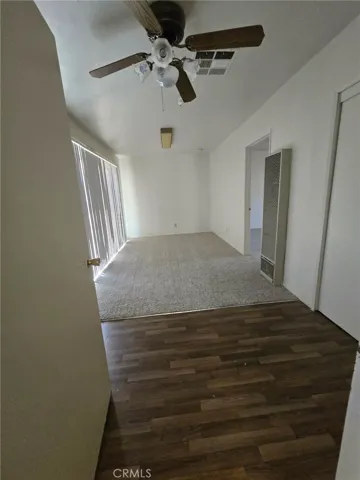1st bedroom off of 2nd living room w/closet and slider that goes to backyard. Also has entry door to another bedroom that has a full bath