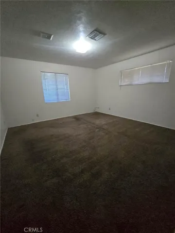 2nd bedroom down main hallway, end of hall to left