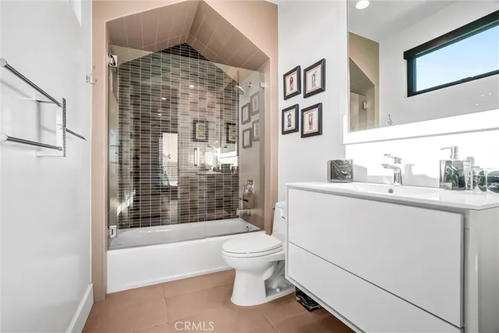 Full bath off Art Room with custom cabinetry and tile