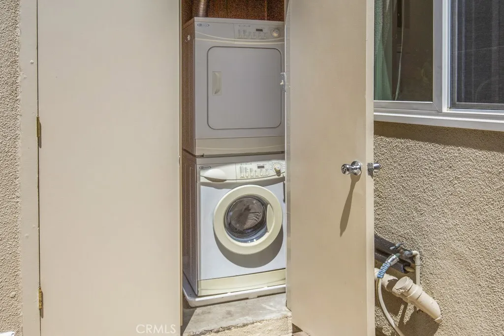 Laundry in storage closet on patio.