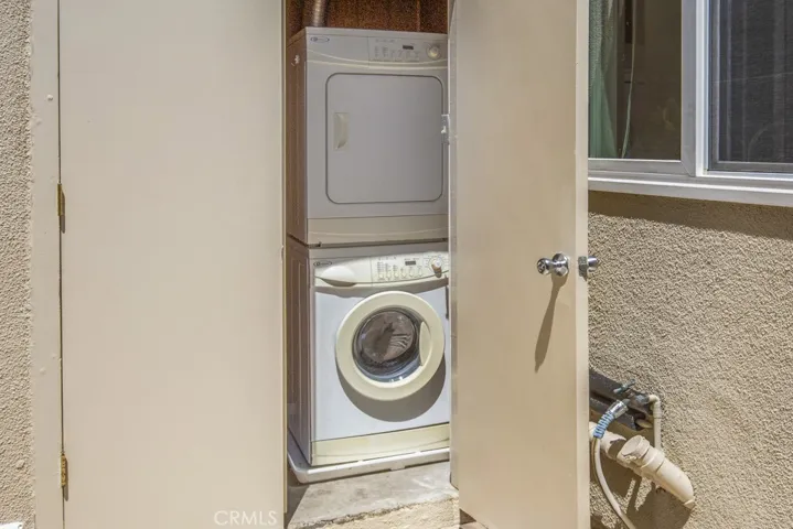 Laundry in storage closet on patio.