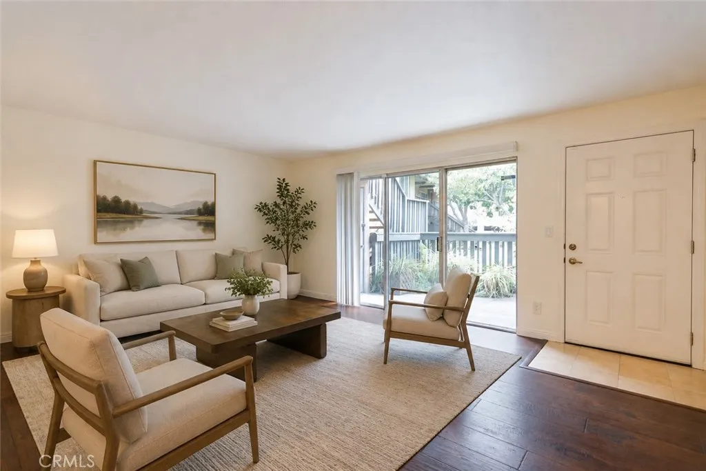 Living to front entry and private patio
Virtually staged photo