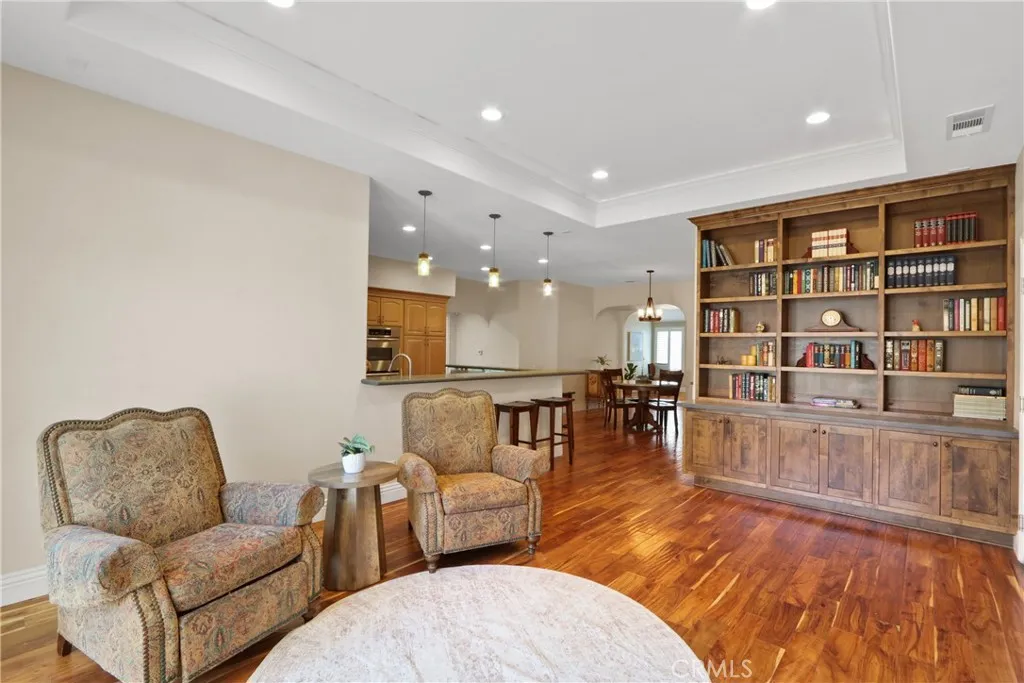 TV area with built-in bookcase.