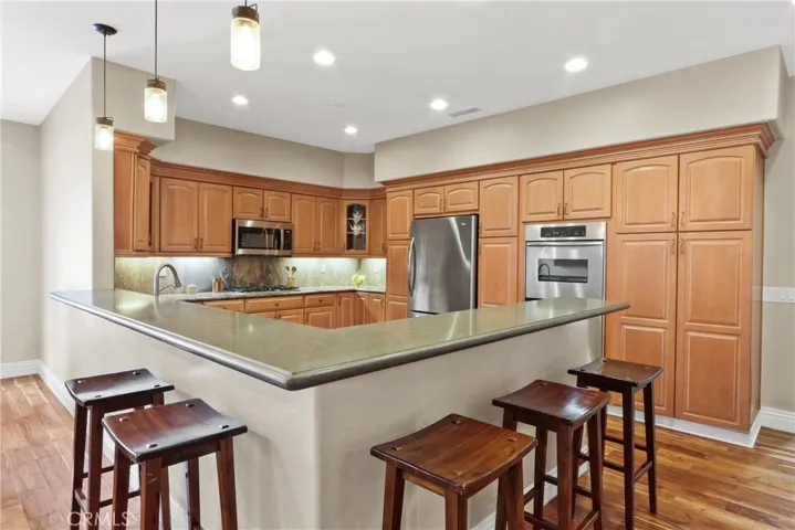 Counter seating, kitchen has tons of storage.