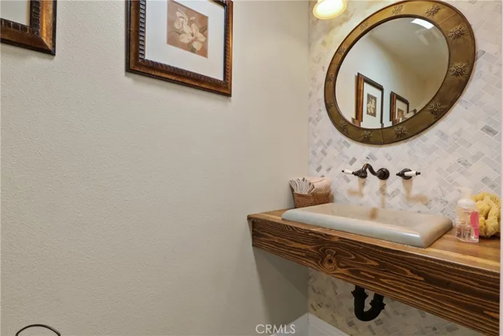 Powder room off of formal entry way.