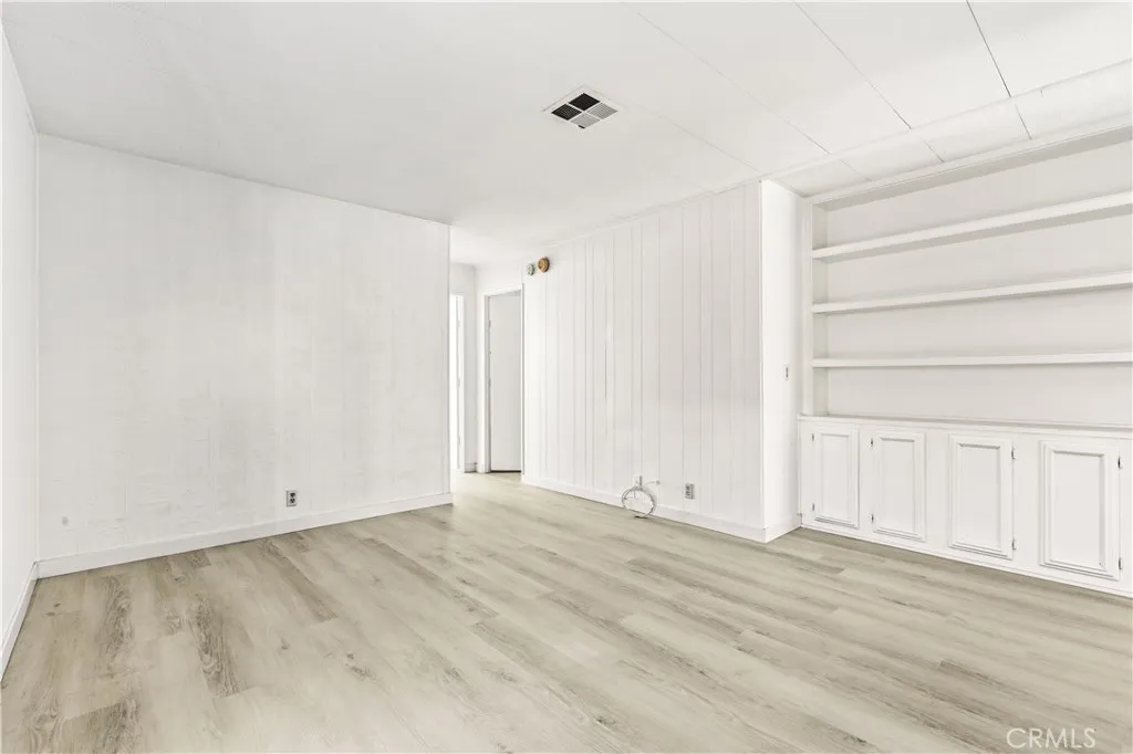 Den w/built-in shelves and cabinets