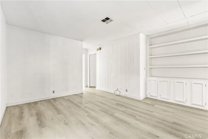 Den w/built-in shelves and cabinets