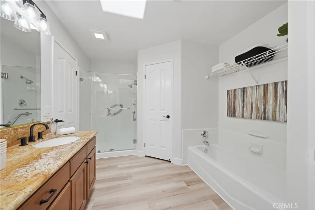 Separate tub and walk in shower for convenience.