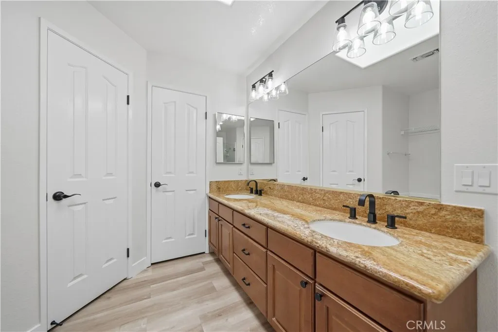 Primary bathroom  with two walk in closets.