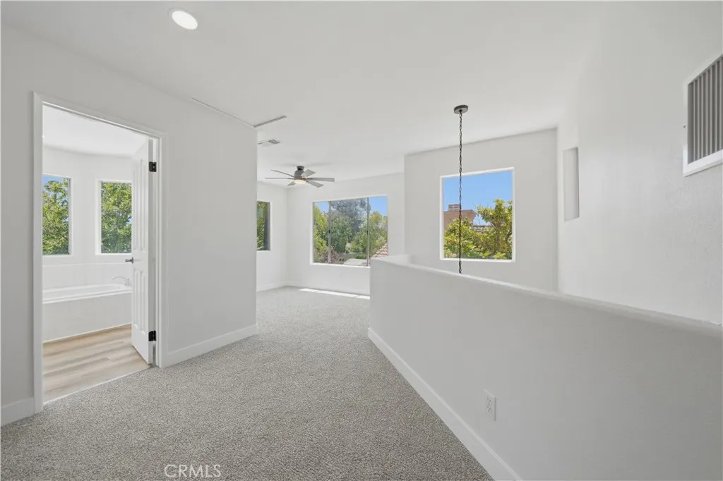 Upper level with loft, full bathroom and guest room.