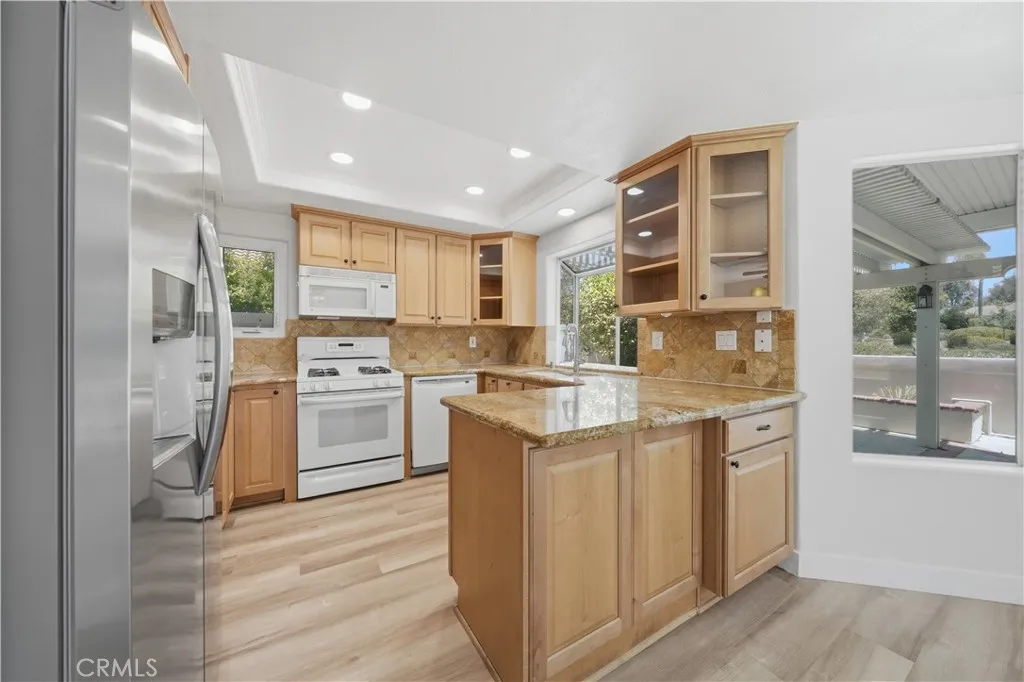 Plenty of storage and glass cabinet doors.