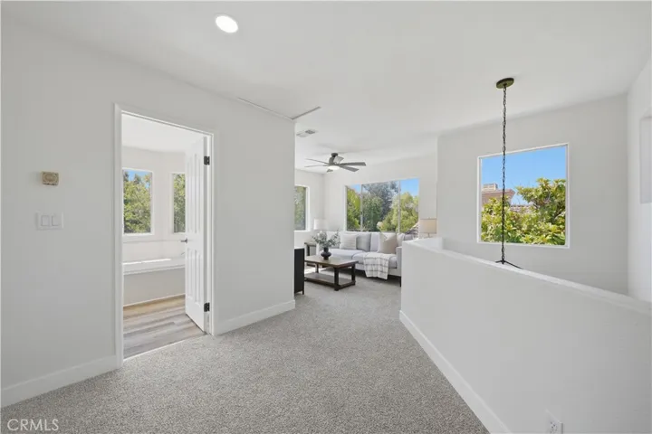 Upper level with loft, full bathroom and a guest room.