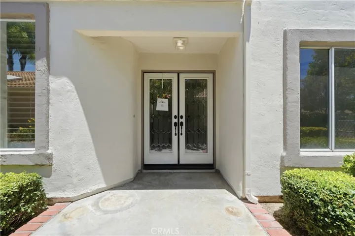 Front door entry is on the side of the house.