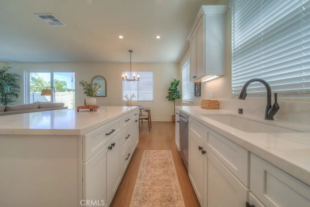 Open Concept Kitchen with quartz countertops, real wood soft close cabinets and drawers.