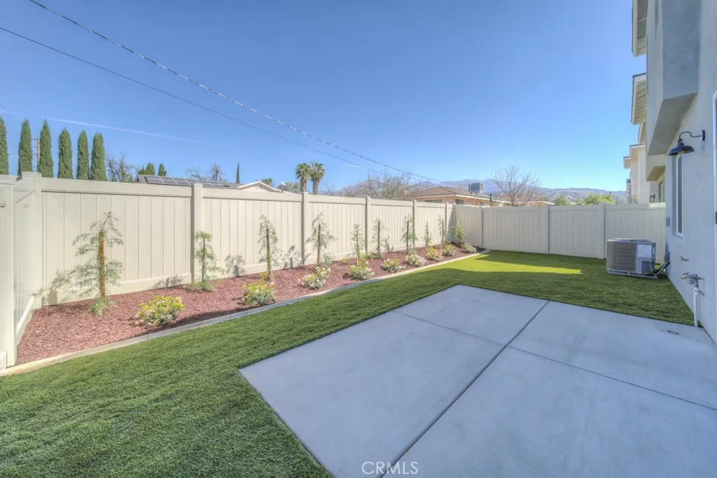 Backyard includes 10' x 14' concrete patio + sidewalk.