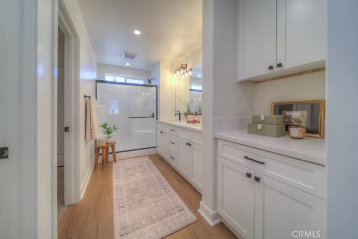 The primary bathroom includes dual vanities, quartz countertops, a private toilet area, and so much more.