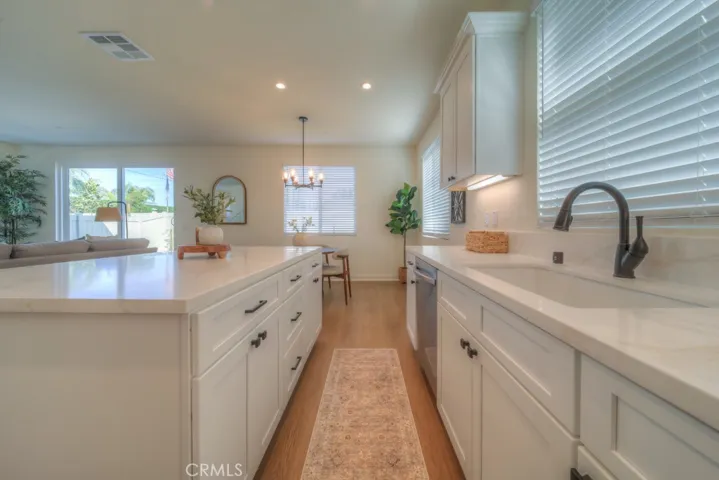 Open Concept Kitchen with quartz countertops, real wood soft close cabinets and drawers.