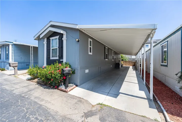 Carport large enough for 4 cars.