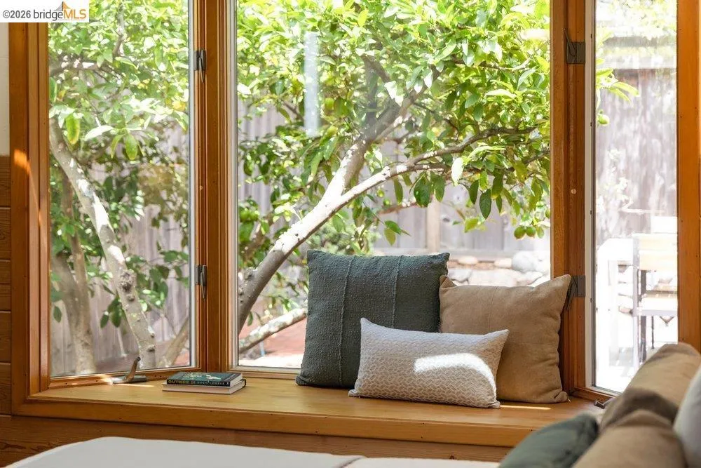 Integrated window seat with natural wood-finish framing