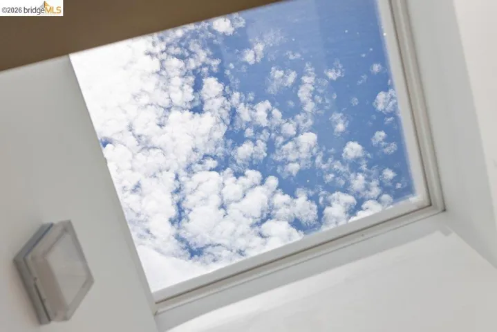 Recessed skylight with white trim and a white ceiling
