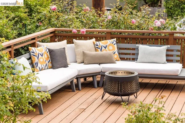 Wood deck featuring a perimeter railing and integrated bench seating