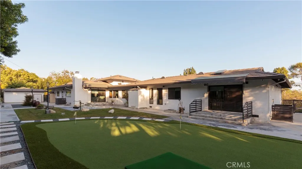 Putting green and rear side of the main residence