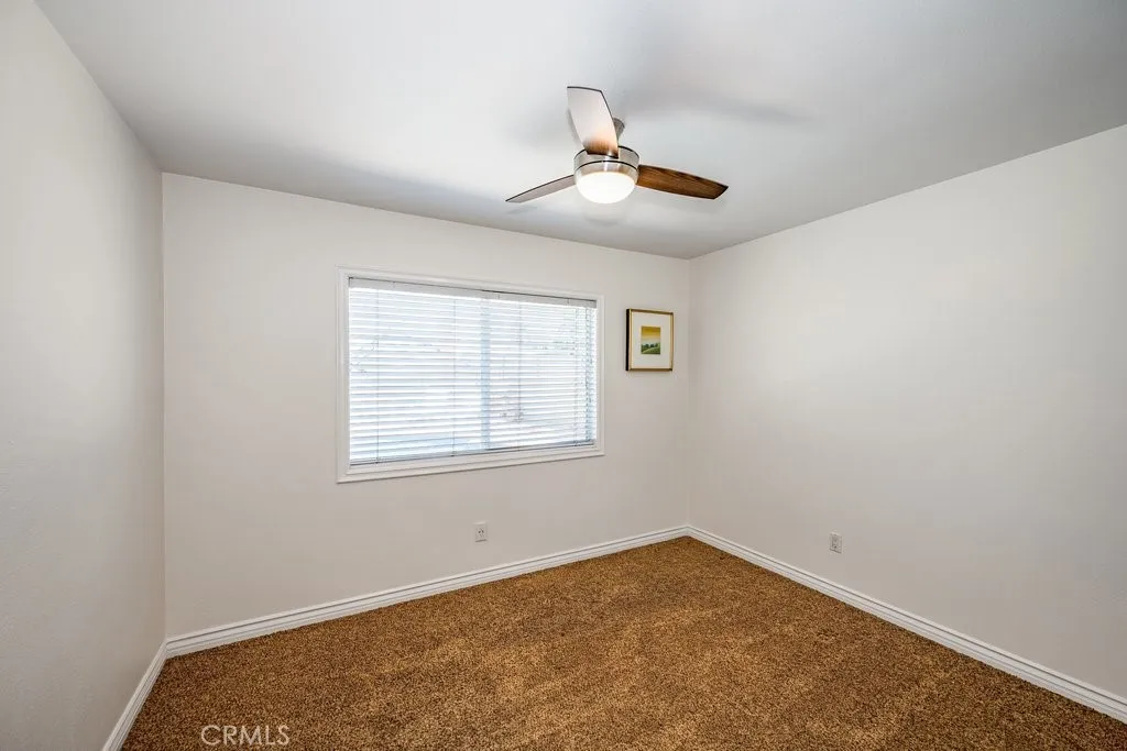 Bedroom with ceiling fam