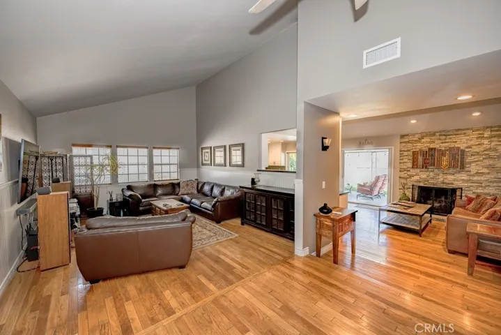 Formal Living Room Landing with views to Family Room and french doors to access covered patio