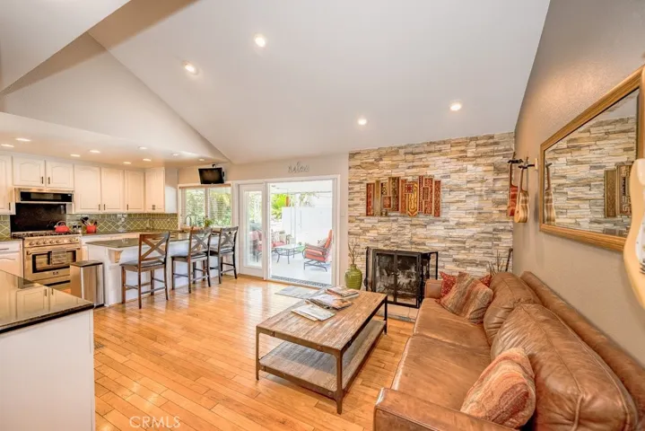 sweeping views of Family Room/Kitchen and access through french doors to outside living areas