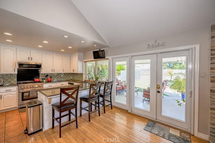 Kitchen with view to covered patio, outdoor living area