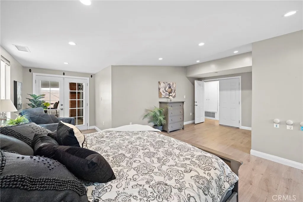 Primary Suite has Sitting Area with French Doors to Backyard