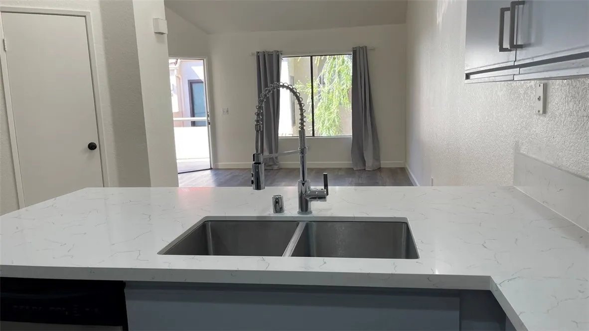 Kitchen looks out to dining area and living room