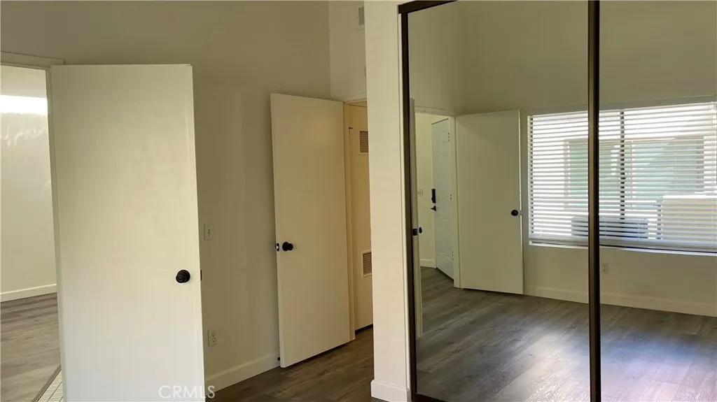 Second Bedroom- Closet, double door entry and door leading to second bathroom