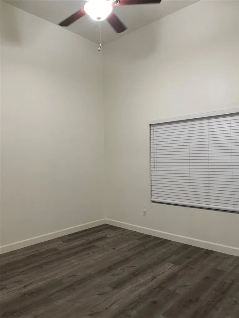 Primary Bedroom with vaulted ceilings and window that open to patio