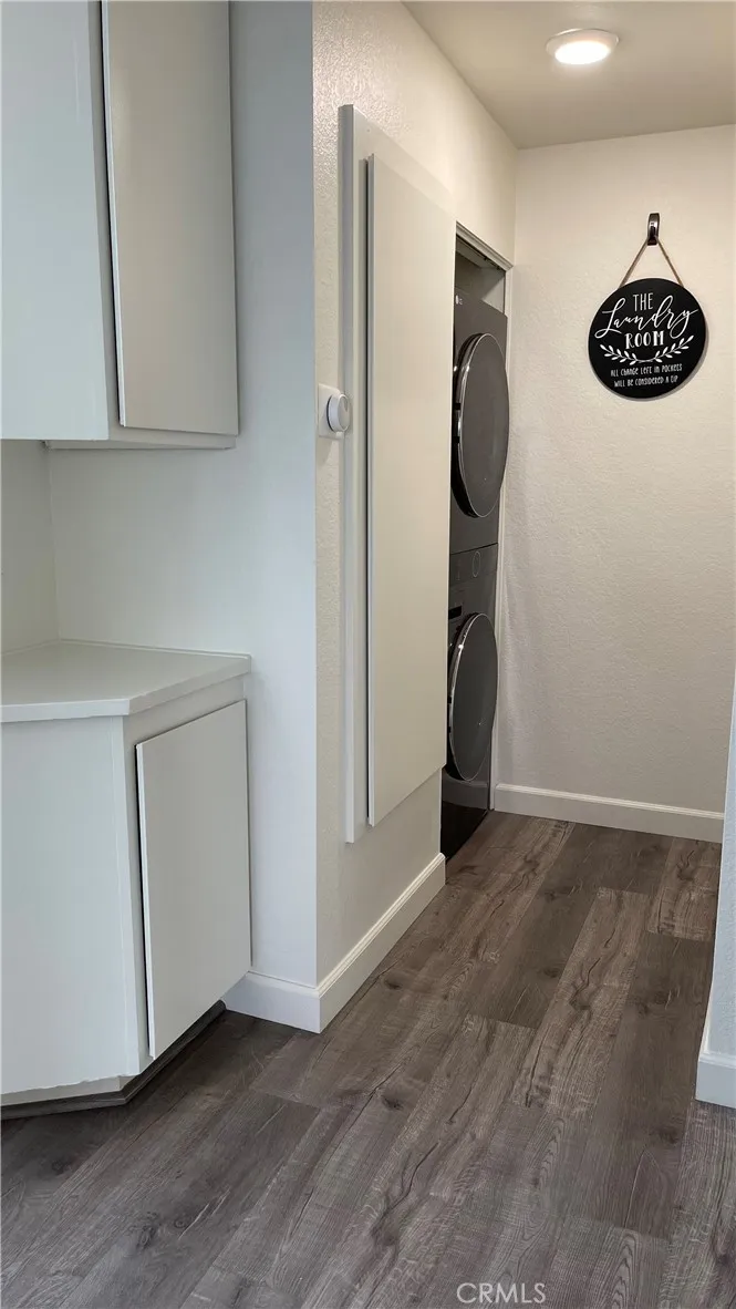 Hallway - linen closet and stackable washer/dryer unit
