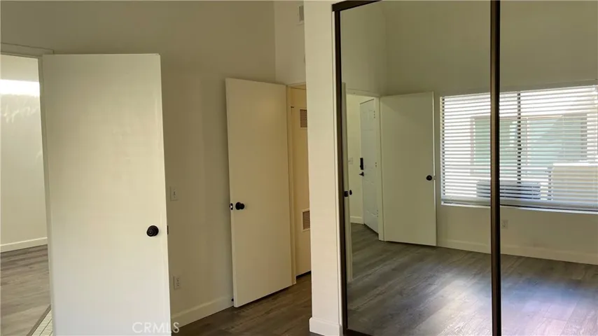 Second Bedroom- Closet, double door entry and door leading to second bathroom
