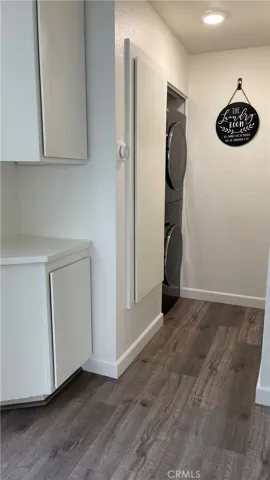 Hallway - linen closet and stackable washer/dryer unit