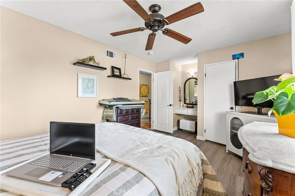 Main bedroom with vanity and walk in closet