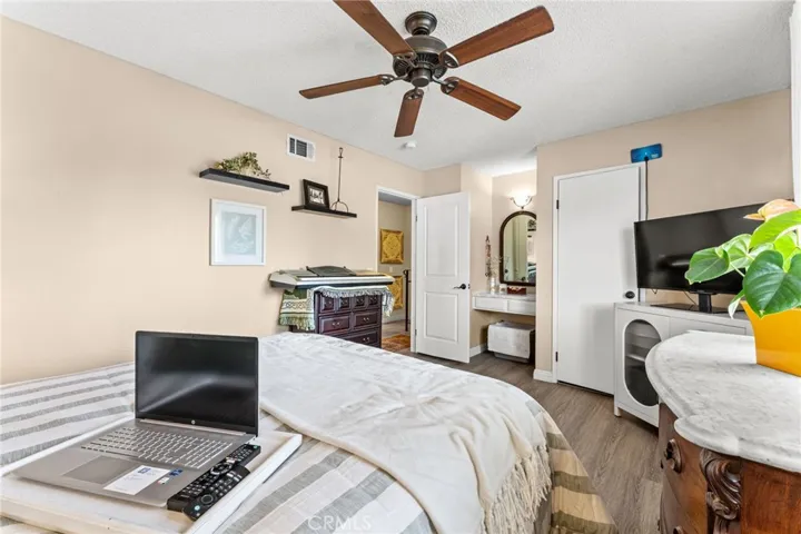 Main bedroom with vanity and walk in closet