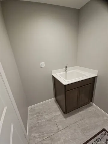 Laundry room has sink