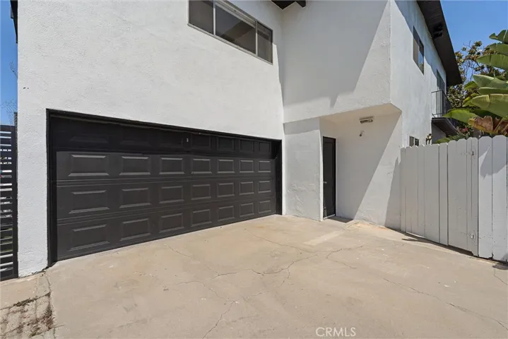 2 car garage with laundry hookups steps from the private patio+ Driveway parking for up to 2 more cars