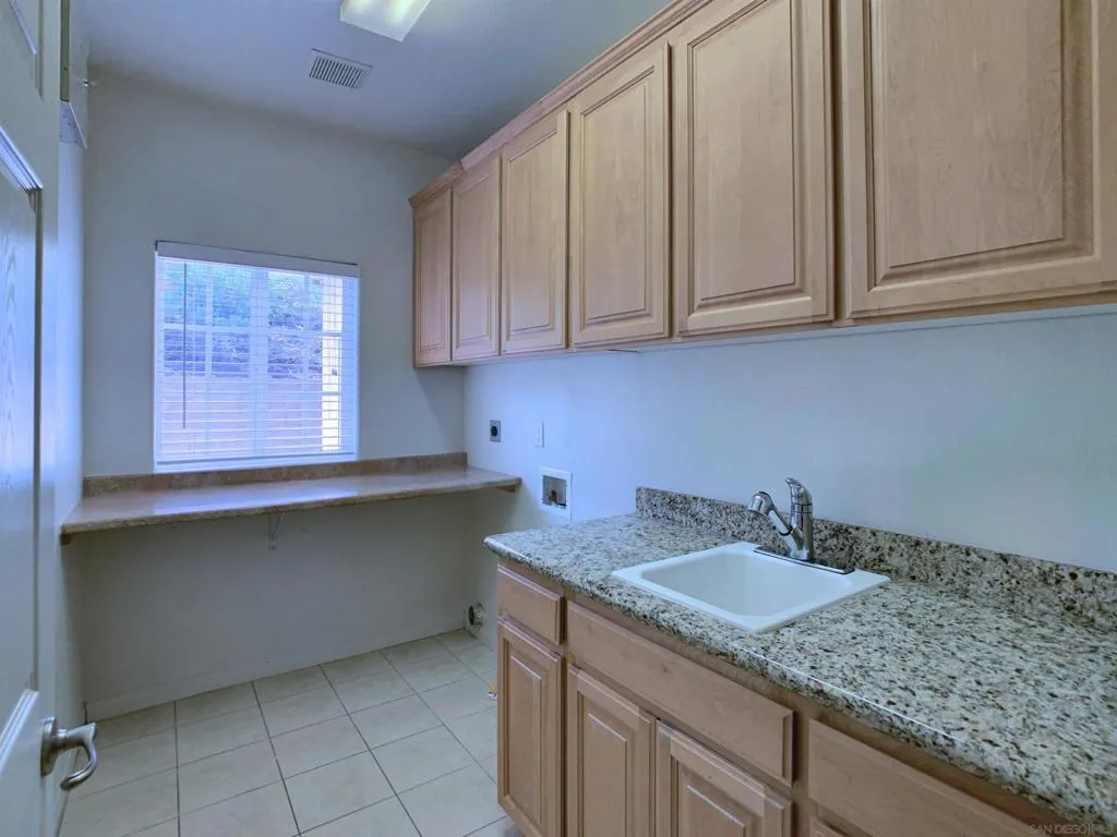 laundry room with storage