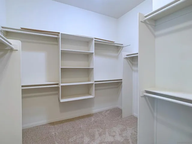 a glimpse of the walk in closet